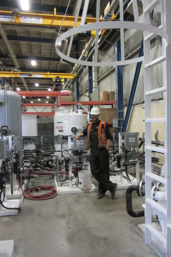 Complete maintenance facility with sub-floor pit, DAF wastewater treatment, wash systems, and exhaust extraction.